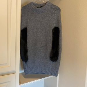 Sweater with real fur arm slits